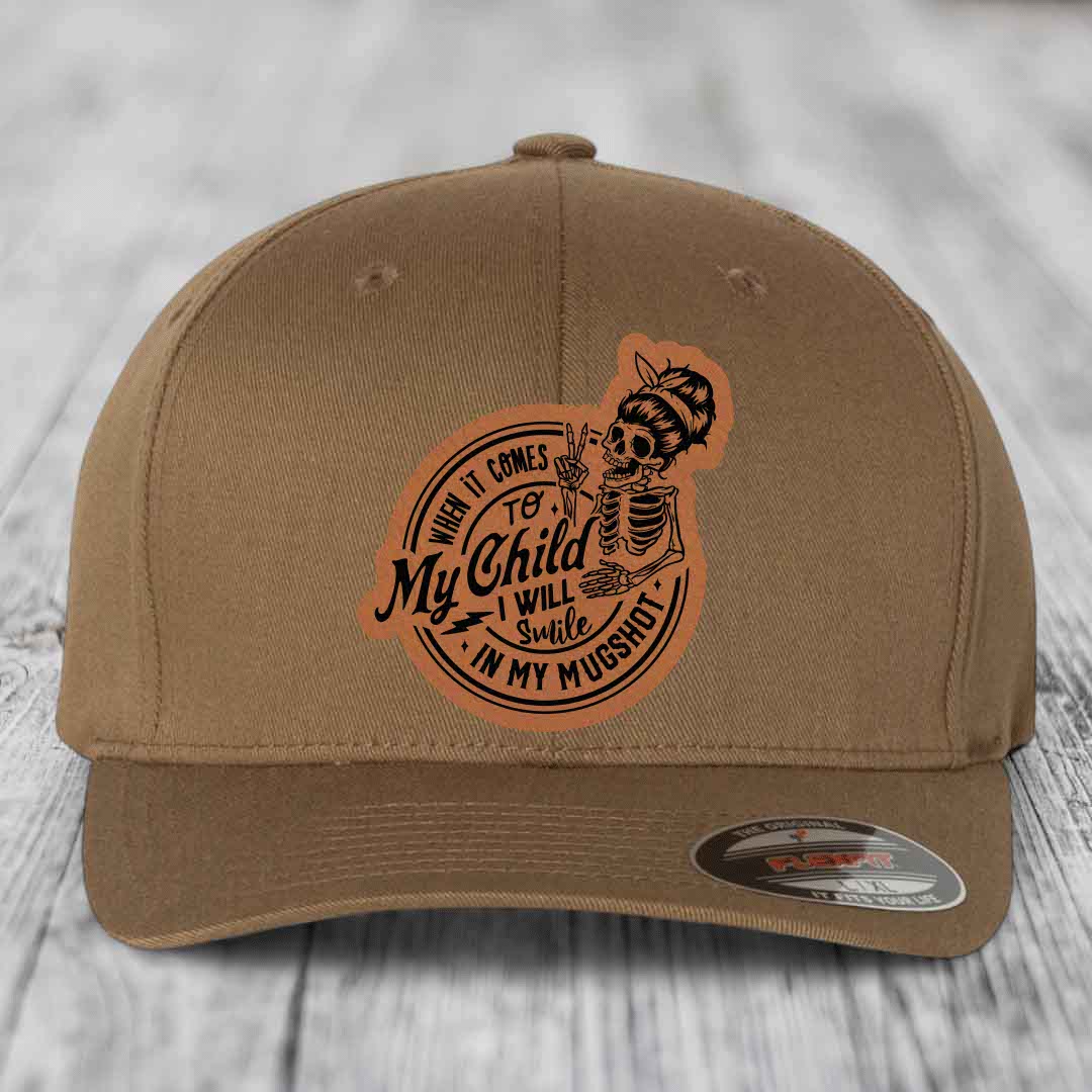 When It Comes To My Child, I Will Smile In My Mugshot (Mama) - Leather Patch Hat - Rawhide to Black Patch - Flexfit 6277 Fitted Hat