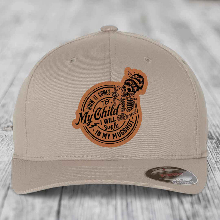 When It Comes To My Child, I Will Smile In My Mugshot (Mama) - Leather Patch Hat - Rawhide to Black Patch - Flexfit 6277 Fitted Hat