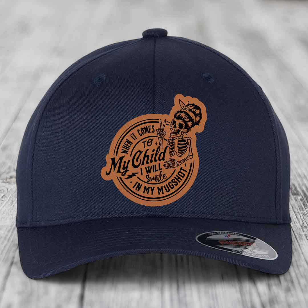 When It Comes To My Child, I Will Smile In My Mugshot (Mama) - Leather Patch Hat - Rawhide to Black Patch - Flexfit 6277 Fitted Hat