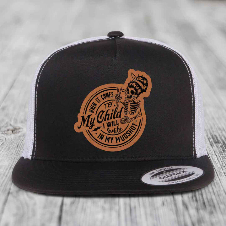 When It Comes To My Child, I Will Smile In My Mugshot (Mama) - Leather Patch Hat - Rawhide to Black Patch - Yupoong 6006 Snapback Flatbill Hat