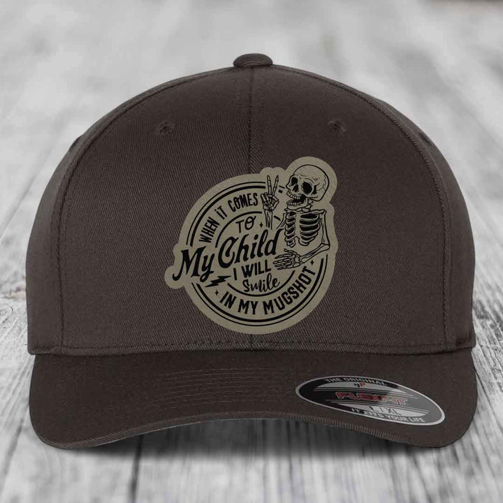 Dark brown baseball cap with a skeleton patch that reads &