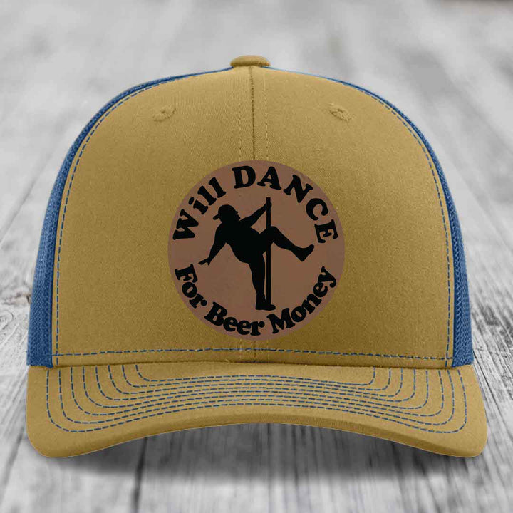 Tan trucker hat with blue mesh back and black embroidered patch reading &