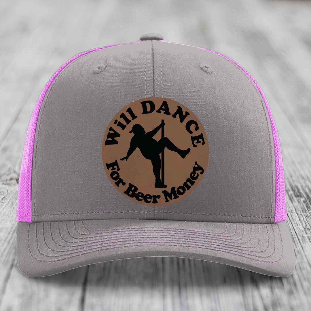 Grey trucker hat with pink mesh and a brown leather patch that says &