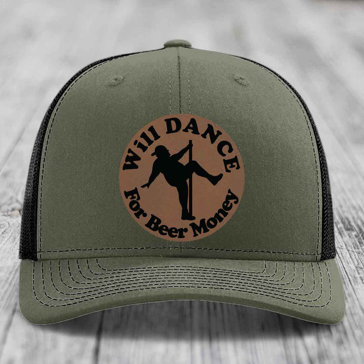 Olive green trucker hat with brown circular patch showing silhouette of person pole dancing and text &