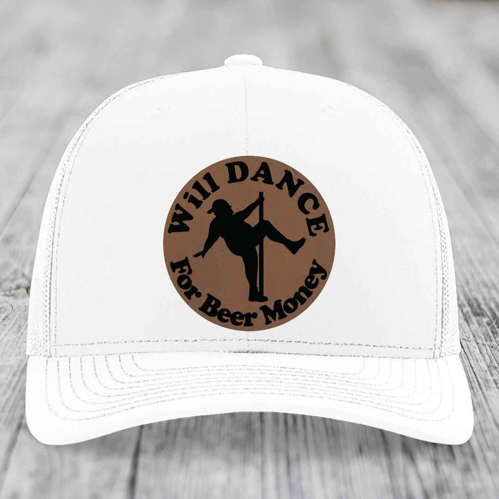 White trucker hat with brown circular patch showing silhouette of person pole dancing and text &