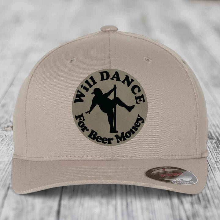 Beige baseball cap with circular patch showing silhouette of person dancing on pole and text &