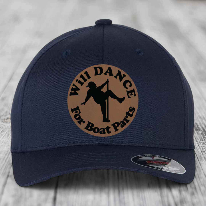 Dark blue baseball cap with circular brown leatherette patch reading &