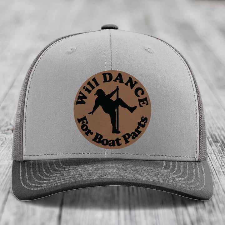Grey trucker hat with brown circular patch reading &