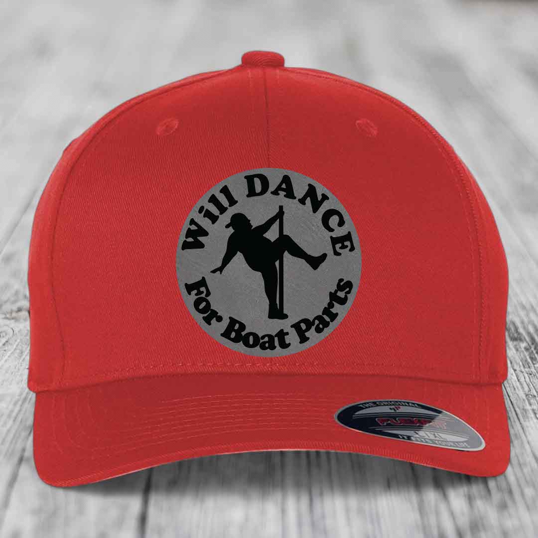 Red baseball cap with circular grey patch featuring black silhouette of dancer and text &