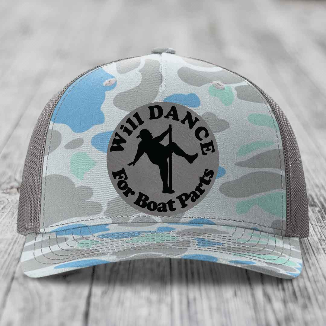 Camouflage trucker hat with black circular patch reading &