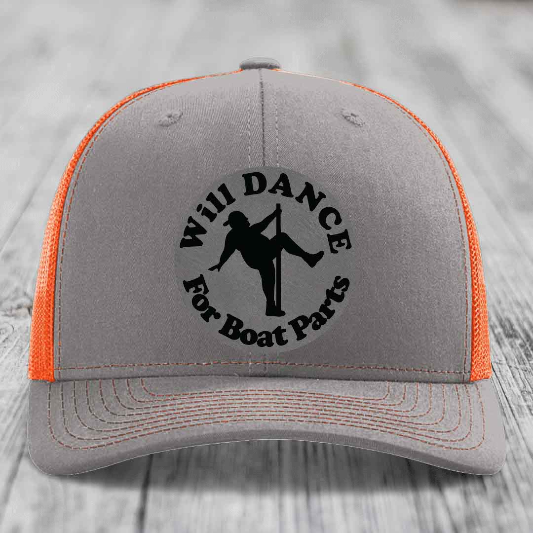 Grey trucker hat with orange mesh back and black embroidered patch reading &