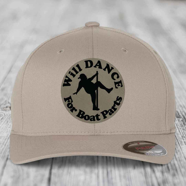 Beige baseball cap with black circular patch reading &