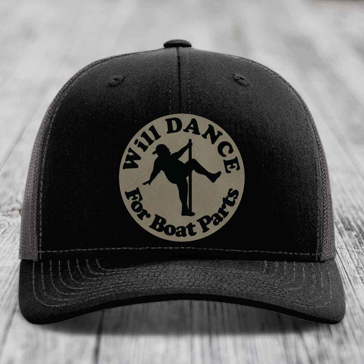 Black trucker hat with circular patch reading &