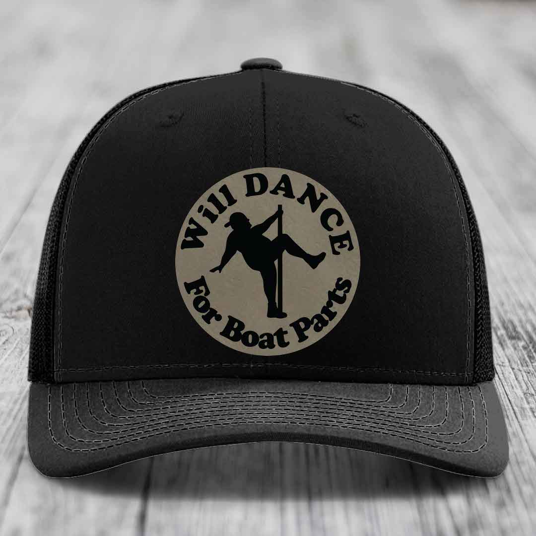 Black trucker hat with circular beige patch reading &