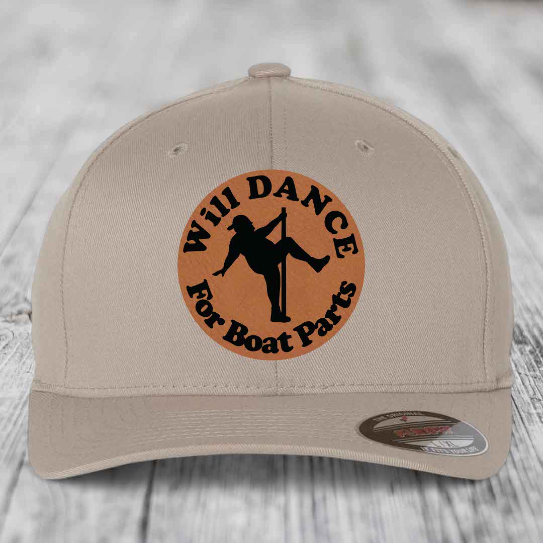 Beige baseball cap with circular brown leather patch featuring black text and pole dancer silhouette.