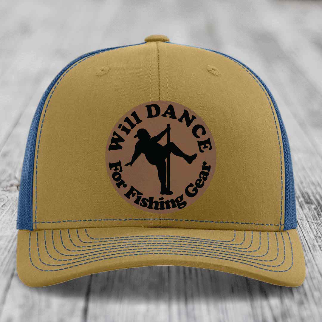 Tan trucker hat with blue mesh back and brim, featuring a circular brown leather patch that reads &