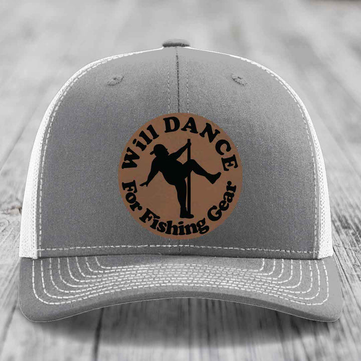 Grey trucker hat with white mesh back and brim, featuring a brown leather patch with black text and dancing figure.