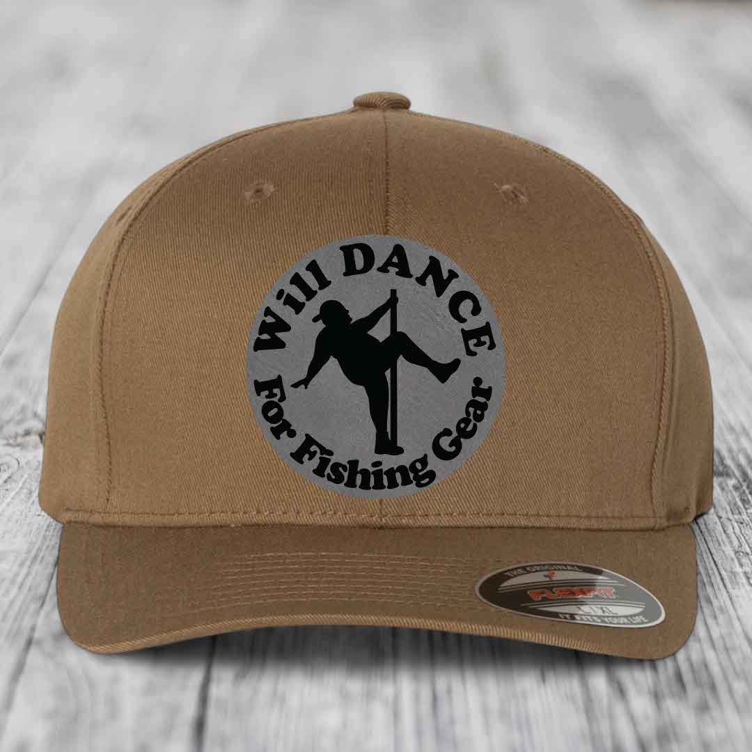 Tan baseball cap with circular grey patch featuring black silhouette of dancer and text &