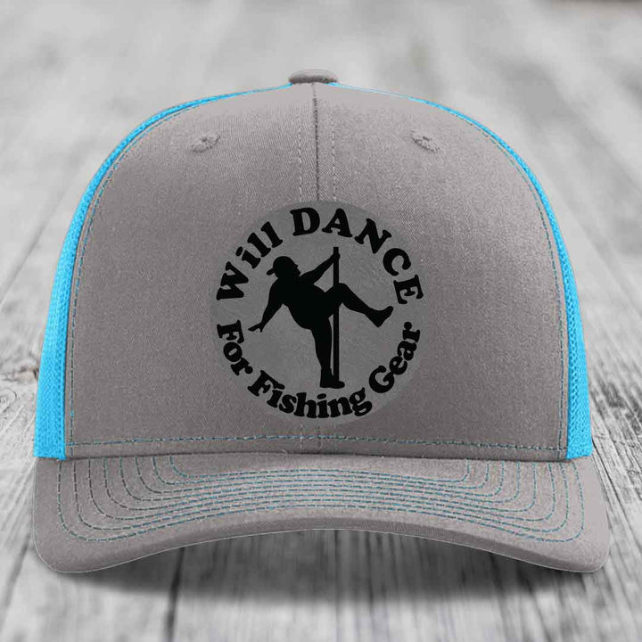 Grey trucker hat with blue mesh back and black embroidered patch reading &