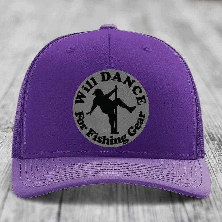 Purple trucker hat with circular patch showing silhouette dancing and text &
