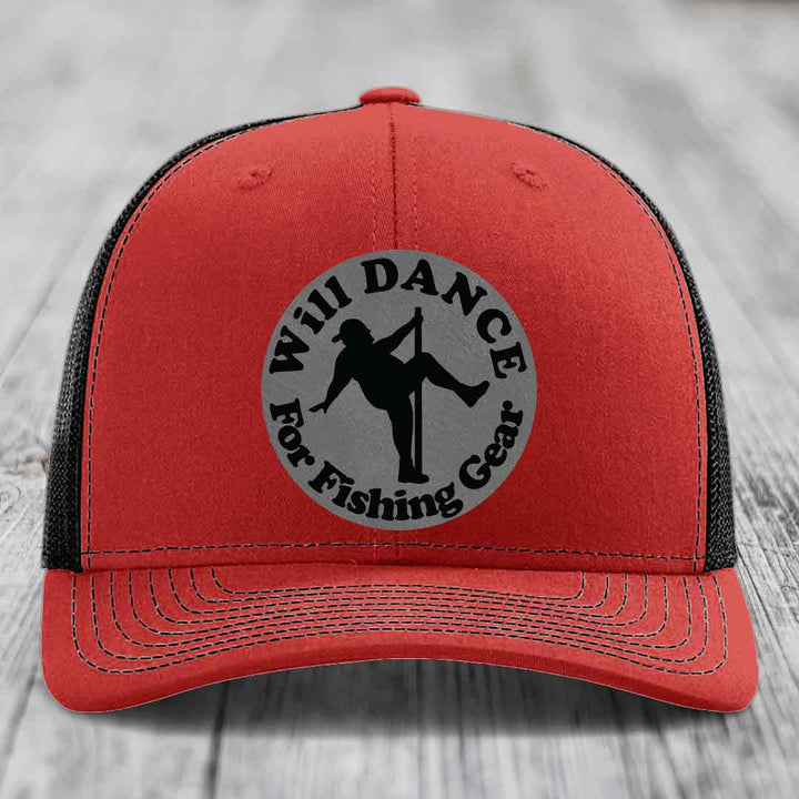 Red trucker hat with black mesh back and gray circular patch reading &