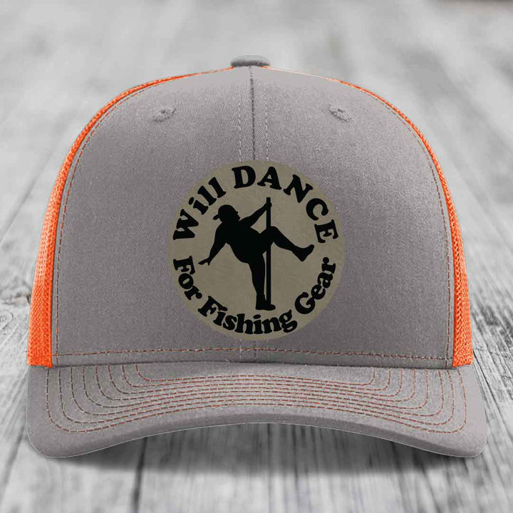 Grey trucker hat with orange mesh back and black embroidered patch reading &