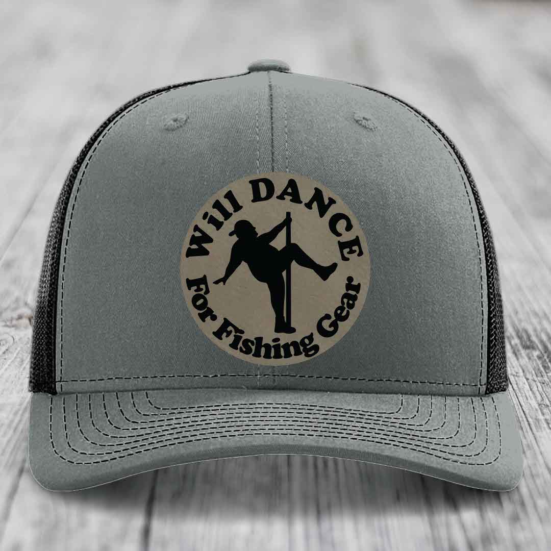 Grey trucker hat with black mesh back and a circular beige patch that reads &