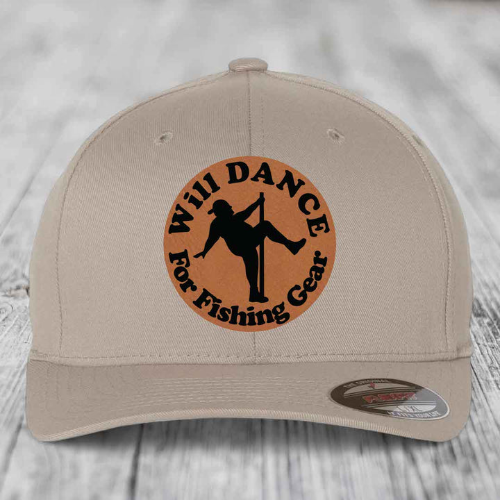 Tan baseball cap with circular brown leather patch showing silhouette of person dancing and text &