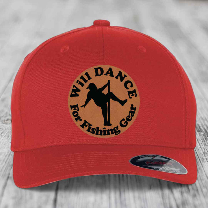 Red baseball cap with circular tan patch featuring black silhouette of person dancing for fishing gear.