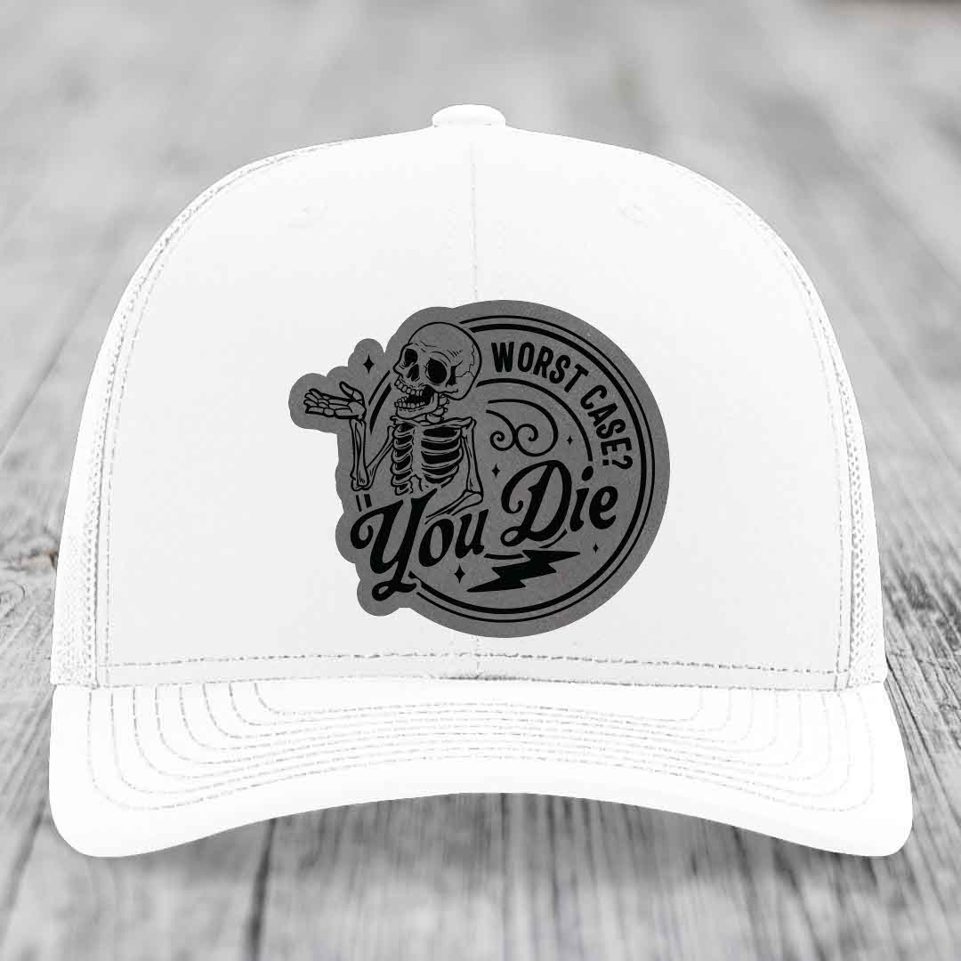 White trucker hat with black circular patch featuring skeleton and text &