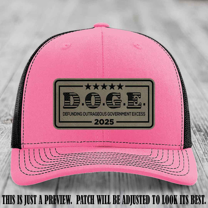D.O.G.E. 2025 leather patch hat with light brown to black patch on a hot pink to black hat