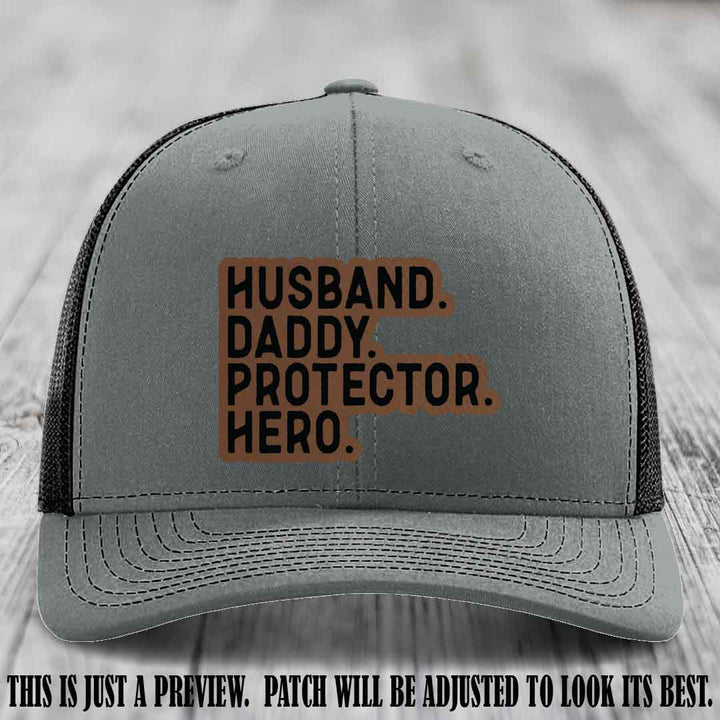 Husband. Daddy. Protector. Hero. Dark Brown to Black Patch on Heather Grey to Black Hat - Richardson 112 Hat
