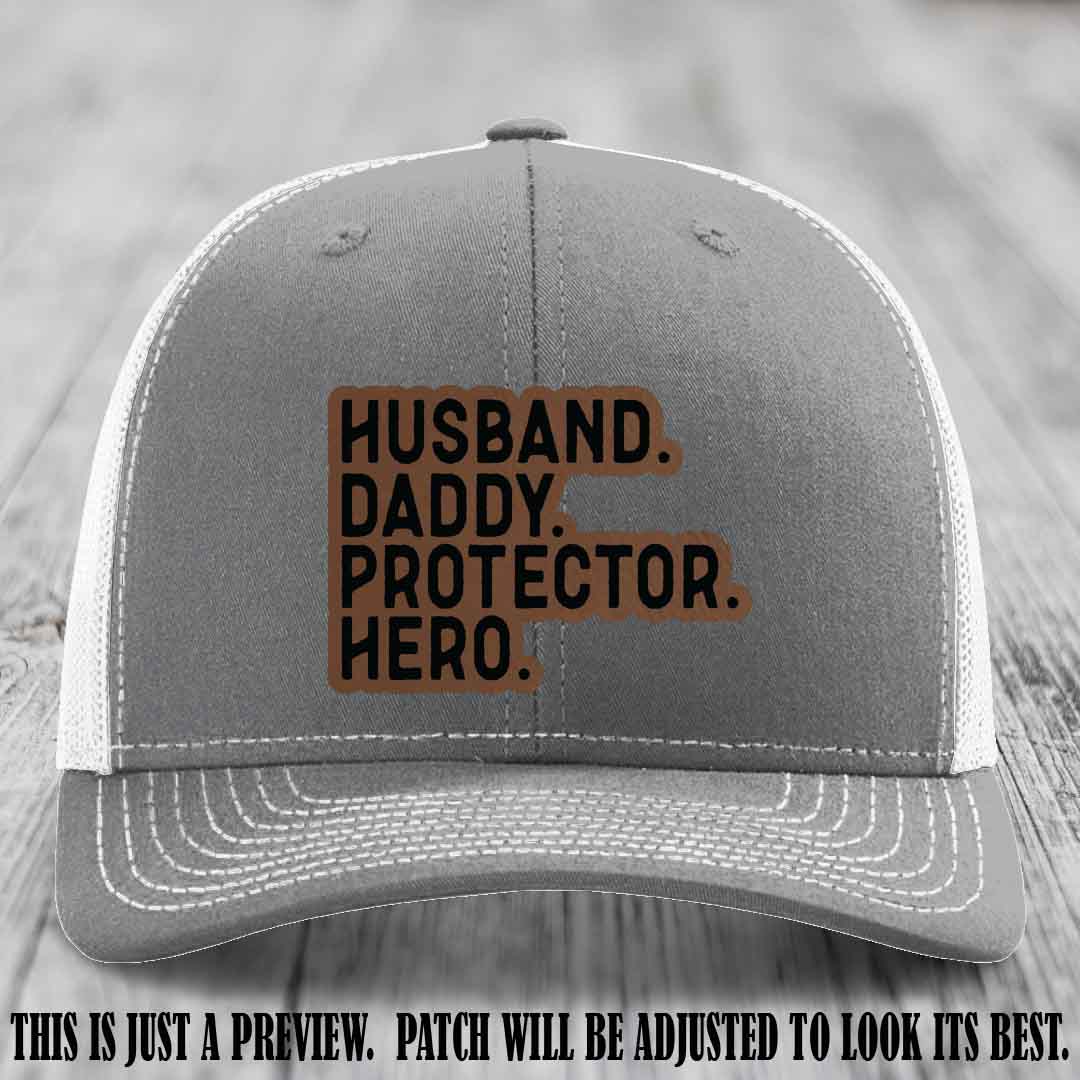 Husband. Daddy. Protector. Hero. Dark Brown to Black Patch on Heather Grey to White Hat - Richardson 112 Hat