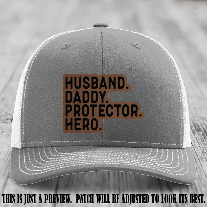 Husband. Daddy. Protector. Hero. Dark Brown to Black Patch on Heather Grey to White Hat - Richardson 112 Hat