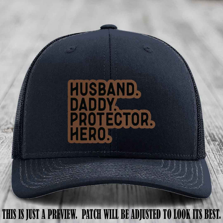 Husband. Daddy. Protector. Hero. Dark Brown to Black Patch on Navy Hat - Richardson 112 Hat