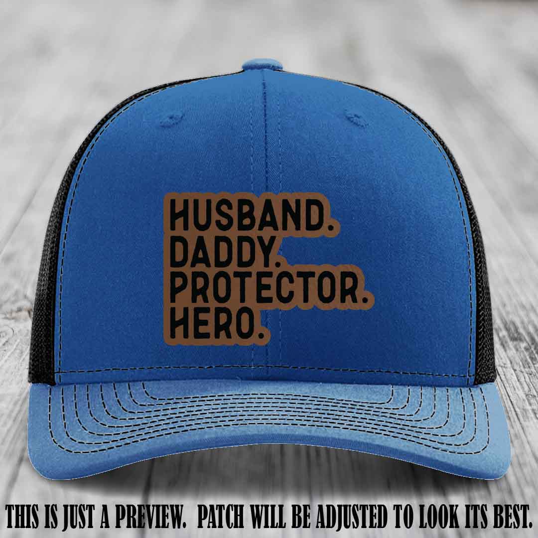 Husband. Daddy. Protector. Hero. Dark Brown to Black Patch on Royal to Black Hat - Richardson 112 Hat