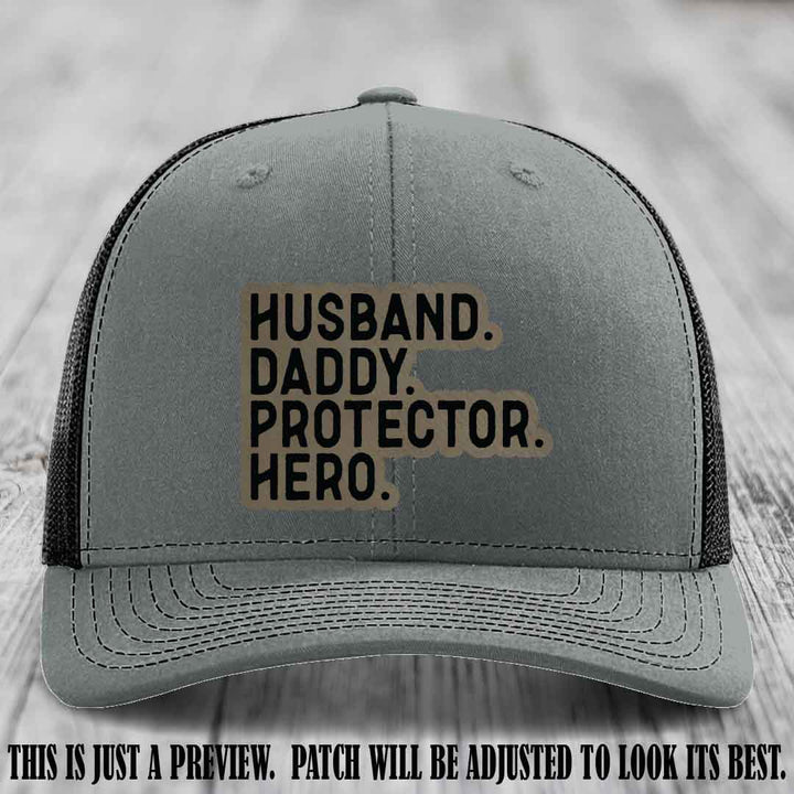 Husband. Daddy. Protector. Hero. Light Brown to Black Patch on Heather Grey to Black Hat - Richardson 112 Hat