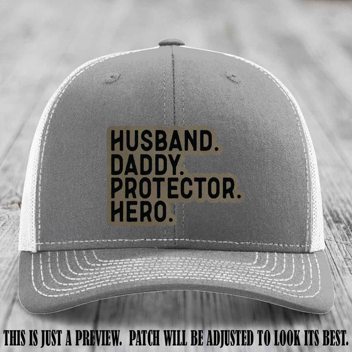 Husband. Daddy. Protector. Hero. Light Brown to Black Patch on Heather Grey to White Hat - Richardson 112 Hat