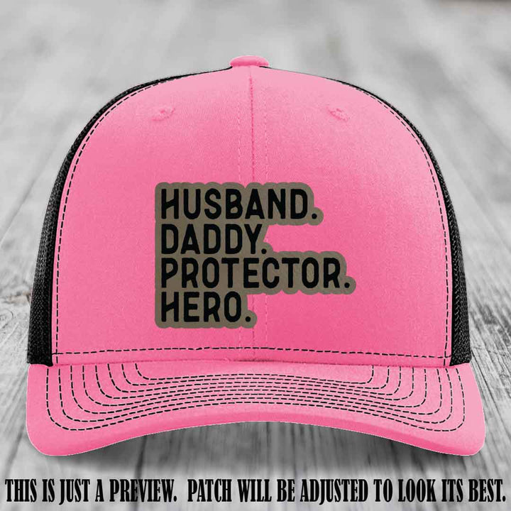Husband. Daddy. Protector. Hero. Light Brown to Black Patch on Hot Pink to Black Hat - Richardson 112 Hat