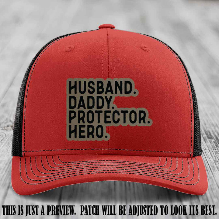 Husband. Daddy. Protector. Hero. Light Brown to Black Patch on Red to Black Hat - Richardson 112 Hat