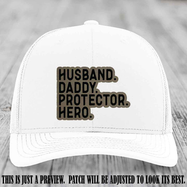 Husband. Daddy. Protector. Hero. Light Brown to Black Patch on White Hat - Richardson 112 Hat