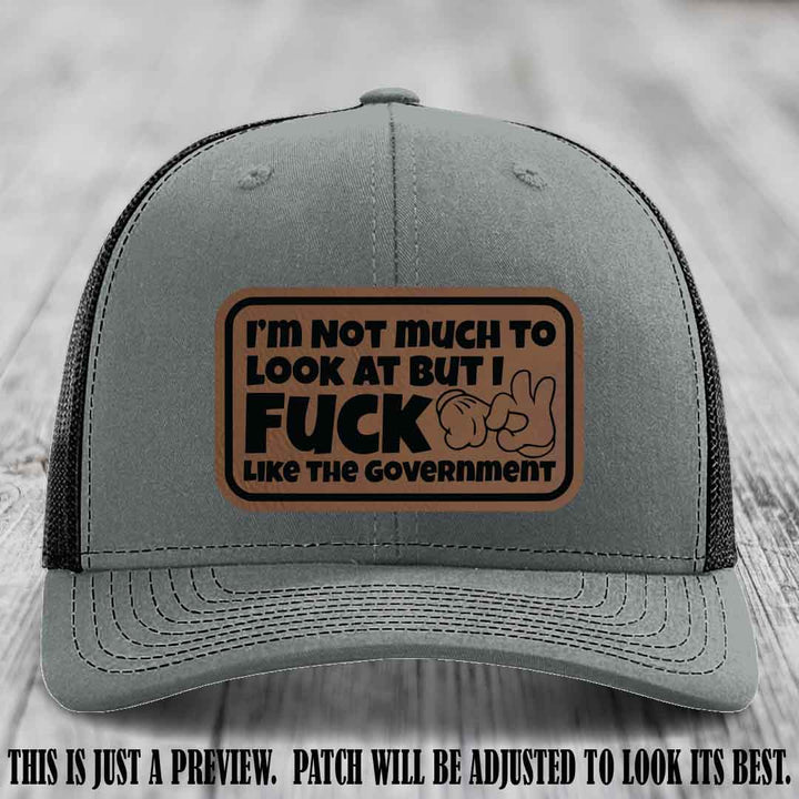 I'm Not Much to Look At Dark Brown to Black Patch on Heather Grey to Black Hat Richardson 112 trucker hat