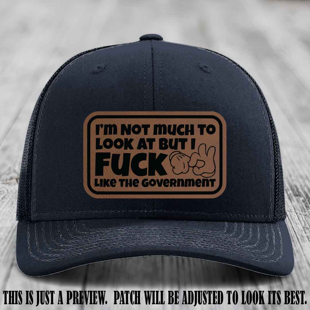 I'm Not Much to Look At Dark Brown to Black Patch on Navy Hat Richardson 112 trucker hat