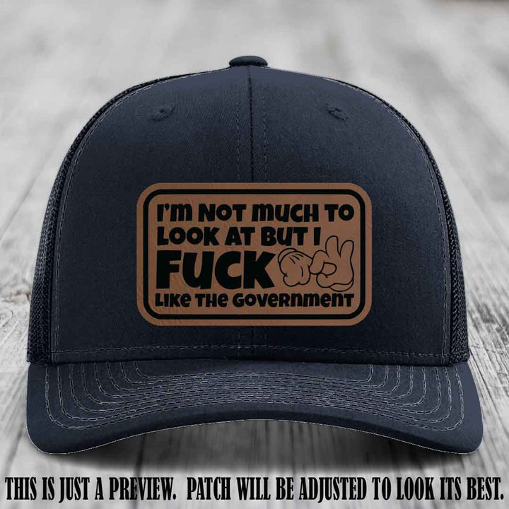 I'm Not Much to Look At Dark Brown to Black Patch on Navy Hat Richardson 112 trucker hat