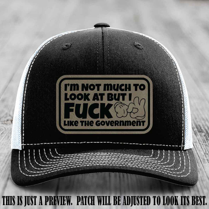 I'm Not Much to Look At Light Brown to Black Patch on Black to White Hat Richardson 112 trucker hat