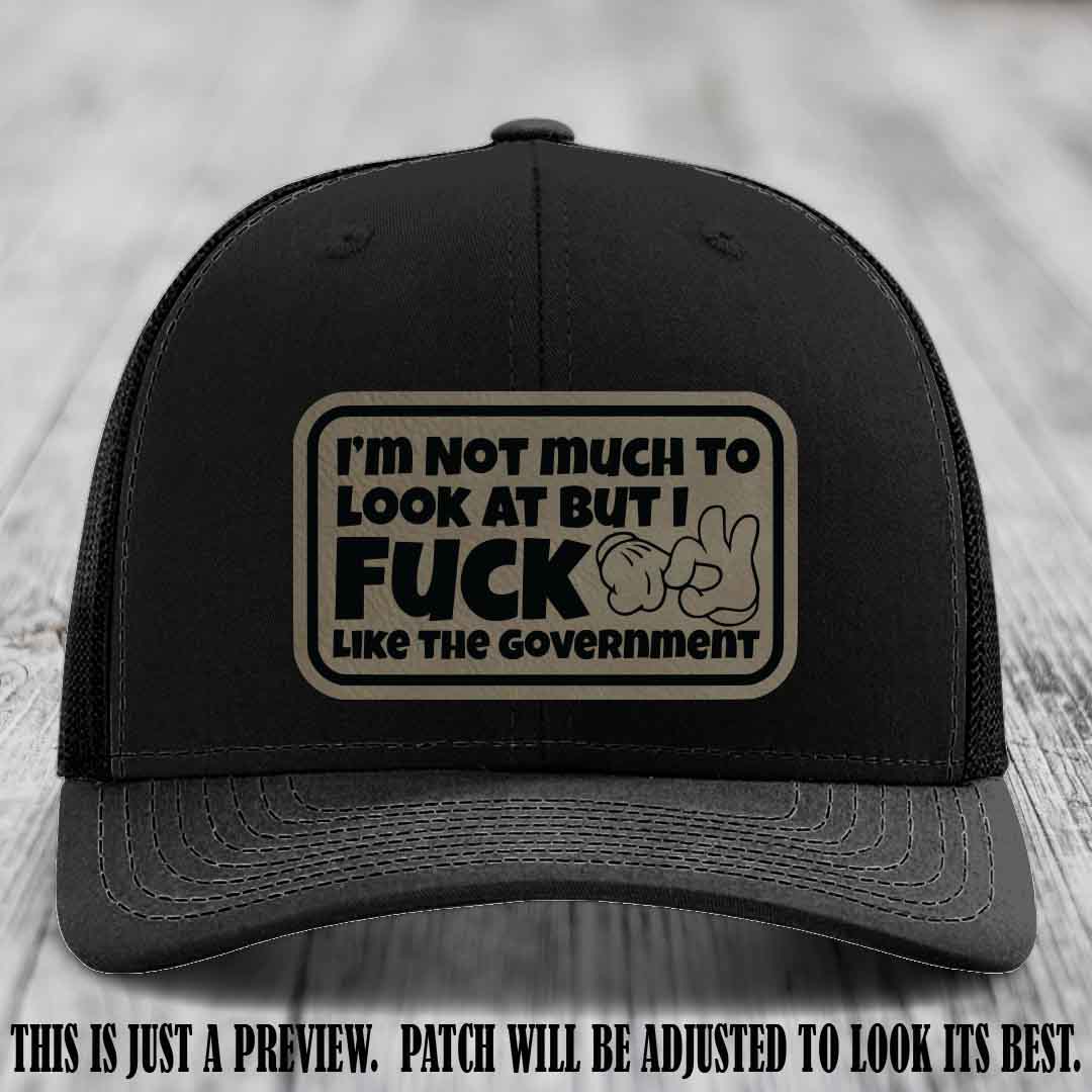 I'm Not Much to Look At Light Brown to Black Patch on Black Hat Richardson 112 trucker hat