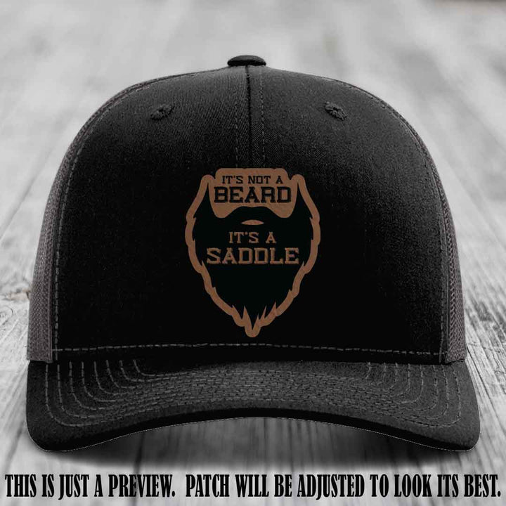 Beard Saddle design on a Dark Brown to Black Patch, Richardson 112 leather patch hat on a Black to Charcoal Hat