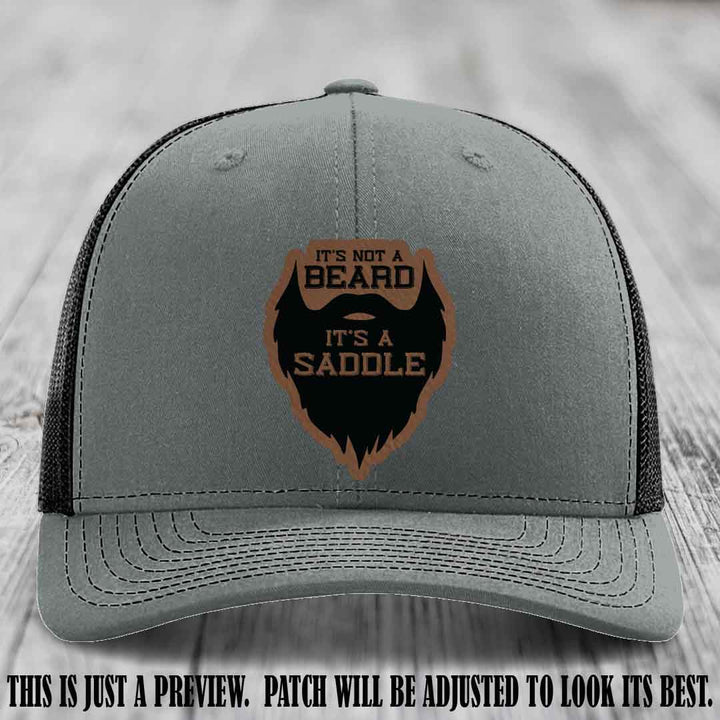 Beard Saddle design on a Dark Brown to Black Patch, Richardson 112 leather patch hat on a Heather Grey to Black Hat