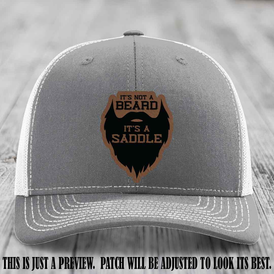 Beard Saddle design on a Dark Brown to Black Patch, Richardson 112 leather patch hat on a Heather Grey to White Hat