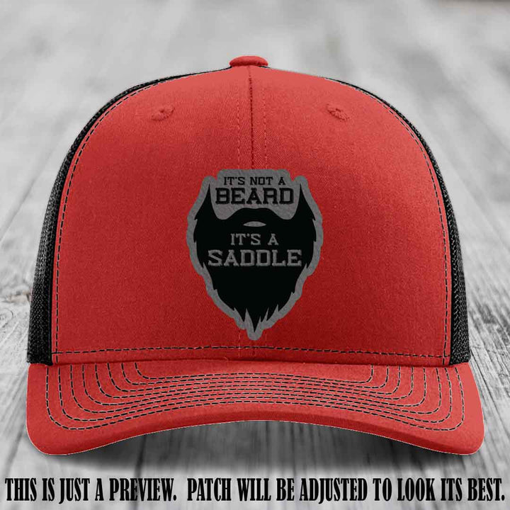 Beard Saddle design on a Grey to Black Patch, Richardson 112 leather patch hat on a Red to Black Hat